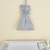 Personalised nursery organiser hanging above changing table in modern Dubai nursery