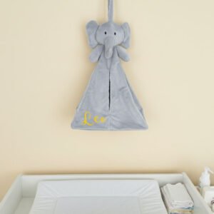 Personalised nursery organiser hanging above changing table in modern Dubai nursery